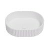 Ellips Fluted 480mm solid surface stone oval above counter basin in matte white