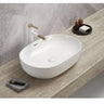 Ellips 610mm oval above counter basin in gloss white on a bathroom vanity top with overflow
