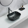 Ellips 460mm rectangular above counter basin in matte black marble look on a white bathroom bench