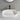 Ellips 600mm solid surface stone above counter basin in matte white with black tall basin mixer