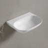 Ellips 500mm gloss white wall hung basin with no tap hole mounted on a wall