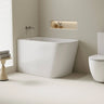 Harvard 1100mm small rectangular corner bath in gloss white installed in the corner of a compact bathroom