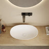 Kirra 580mm solid surface stone oval above counter basin in matte white with wall mixer