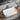 Kliff 605mm rectangular above counter basin in matte white on a bathroom vanity top