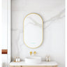 Maia 500x900mm oval motion sensor LED mirror with brushed gold frame in a bathroom above a round basin