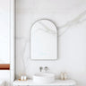 Maia 600x900mm arch motion sensor LED mirror with gun metal frame in a bathroom above a round basin