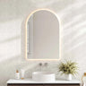 Mercio Luna 600x900mm arch frameless backlit LED mirror in a bathroom above a round basin