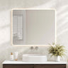 Mercio Luna 900x750mm rectangular frameless backlit LED mirror in a bathroom above a round basin