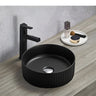 Olley Fluted matte black round above counter basin on a timber vanity with black tall mixer
