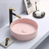 Olley 395mm round above counter basin in matte pink on a bathroom vanity top