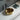 Ollia 345mm gold round above counter basin with brushed gold exterior on a white bathroom bench