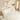 Rose 1500mm fluted left corner bath in matte white seen from above, with wall-mounted brushed brass tapware