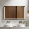 Venus 1200x750mm rectangular front-lit motion sensor LED mirror with brushed nickel frame in a bathroom above a round basin