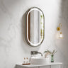 Venus 500x900mm oval front-lit motion sensor LED mirror with gun metal frame in a bathroom above a round basin