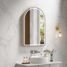 Venus 600x900mm arch front-lit motion sensor LED mirror with brushed nickel frame in a bathroom above a round basin
