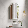 Venus 600x900mm arch front-lit motion sensor LED mirror with gun metal frame in a bathroom above a round basin